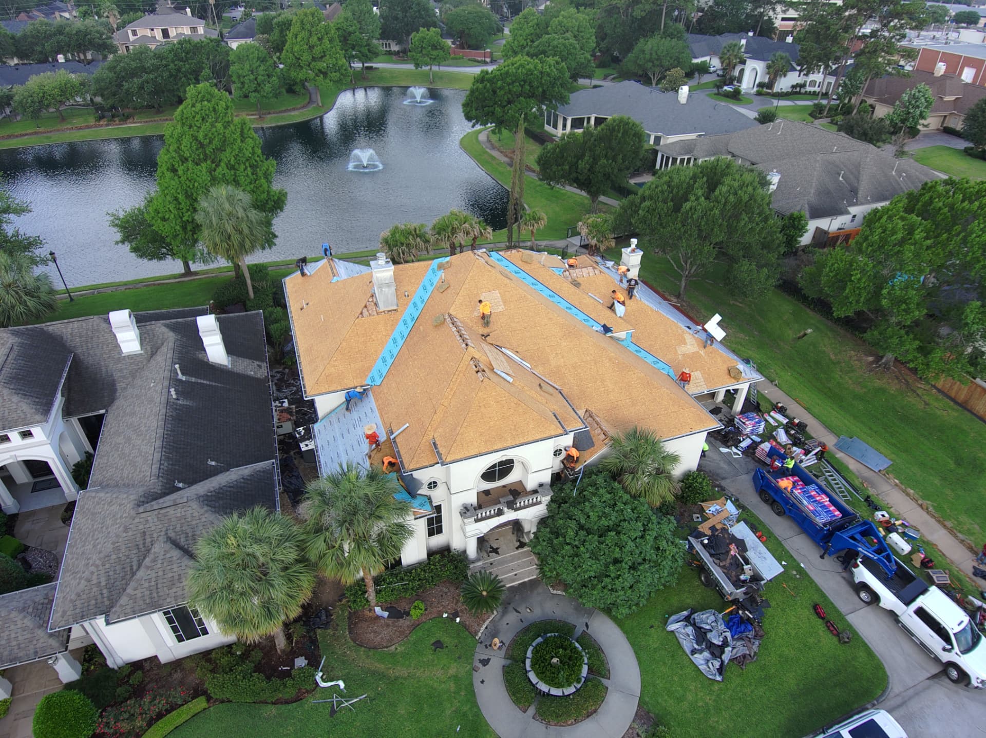 Aerial drone photo of a completed architectural shingle roof on a Houston-area home