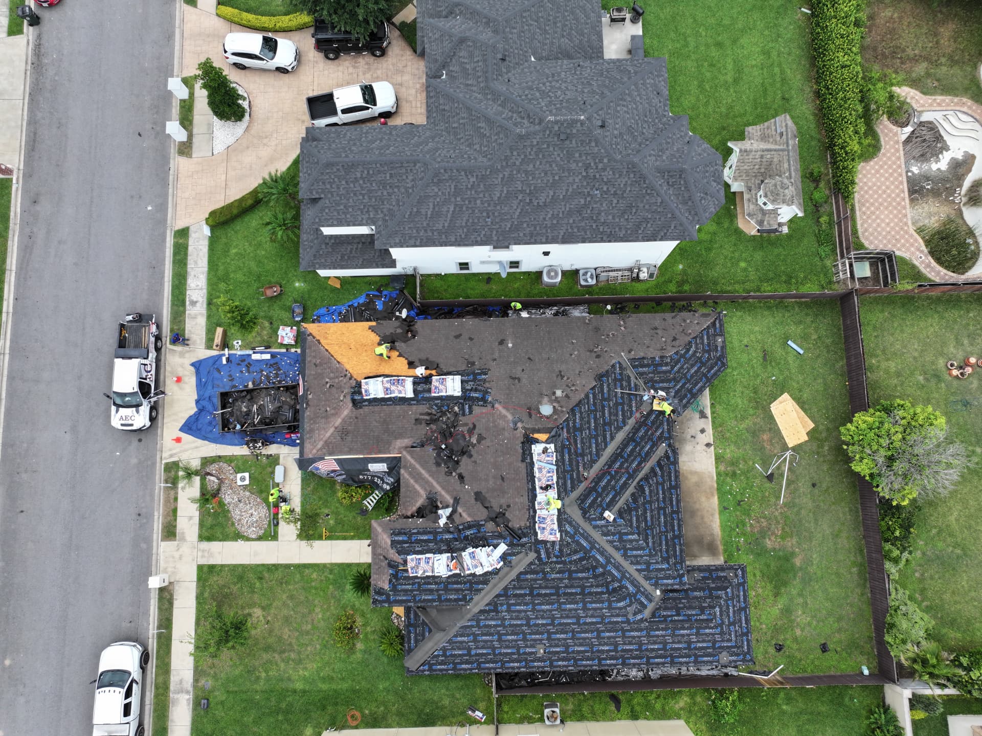 Aerial drone photo of a residential roof replacement with new underlayment installed