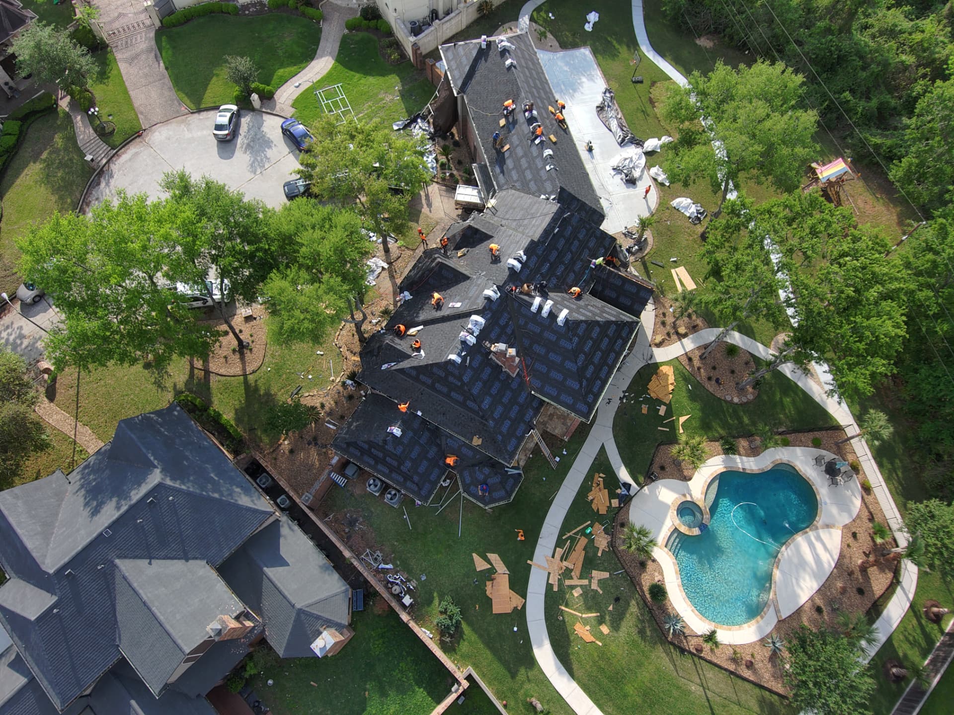Drone shot of synthetic underlayment installed across a large residential roof